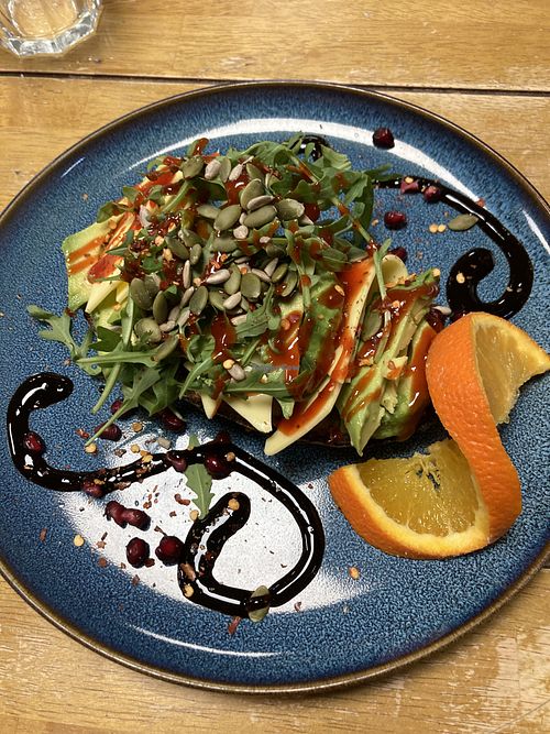 Avocado toast with vegan cheese  at Cafe MOOand BOOM in Whitchurch