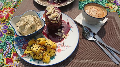 Pancake stack with peanut butter chocolate chip banana ice cream and pineapple.  at DAO of Life in Sihanoukville