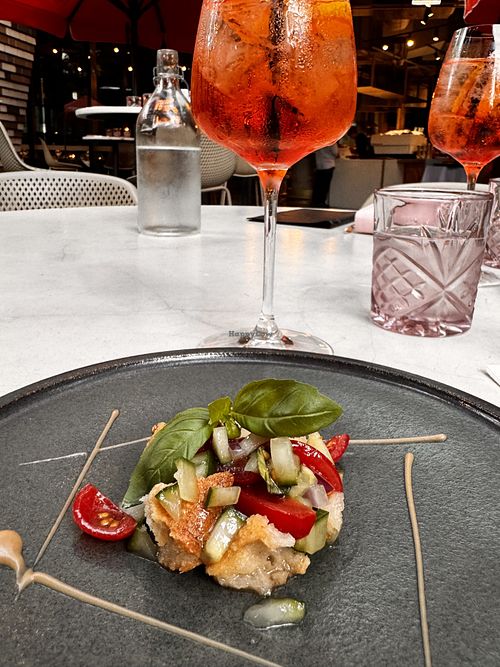 Small bites with cucumber, tomato and breadd  at Italia Lane in Fortitude Valley