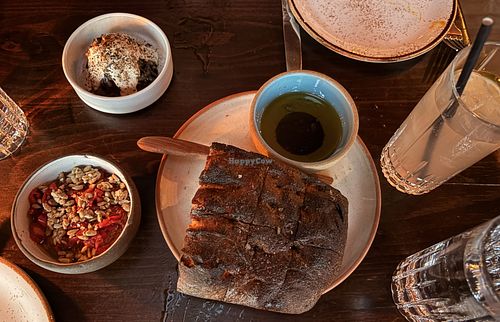 Focaccia with three dips: olive oil, burnt carrot tahini, and mushroom duxelle with pine nut cream  at Deer Mountain Inn in Tannersville
