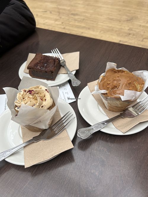 Vegan cherry brownie, vegan banana, chocolate, and Biscoff muffin, vegan coffee & walnut muffin.   at Bruschetta by Food Cabaret in Leeds