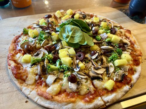 Vegan pizza with vegan cheese, veggies and pineapple (customizable)  at Pancake Rocks Cafe in West Coast