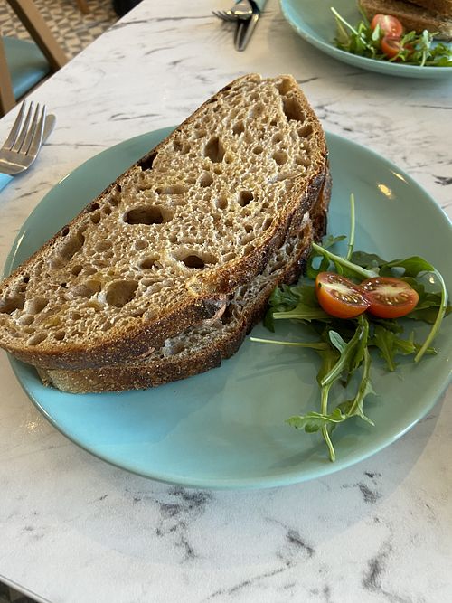 Vegan sausage sandwich on sourdough  at Ella's Cafe Lounge in Paignton