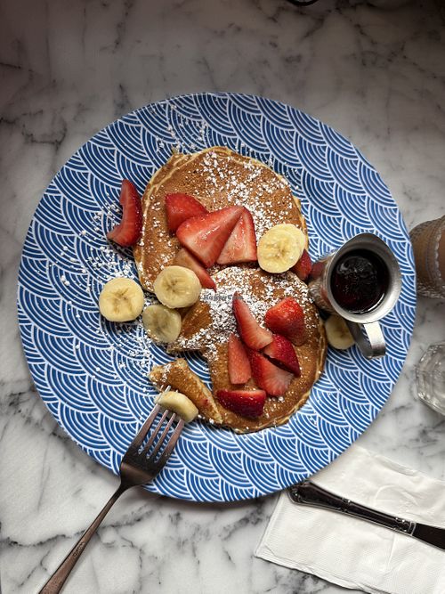 Vegan pancakes with banana and strawberries.  at Blue Daisy in Santa Monica