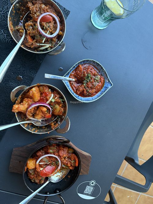 Aubergine made in the tandoori oven, vegetable Karahi and Aloo Gobhi curries   at Tandoori Treasure Indian Restaurant in Roquetas De Mar