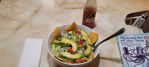 Bean and rice bowl topped with lettuce and avocado at Mama Mayra's Kitchen in Eugene