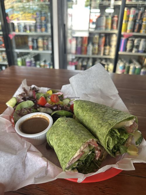 Tree Hugger Wrap with a salad! So fresh and tasty.  at Kiss Cafe in Seattle