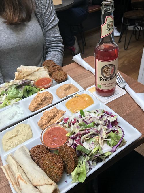 Falafel plate (3 falafel balls, pita bread, salada, 3 dips of your choice and chili tomato sauce on request) at Vegi in Tubingen
