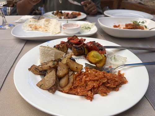 Stewed cabbage, potatoes and mushrooms, vegetable skewer   at Joy Chaikhana Lounge  in Bukhara