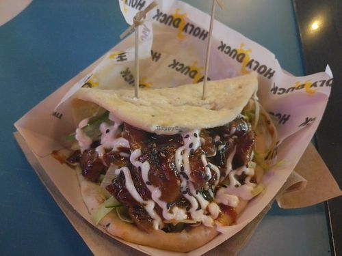 Vegan shredded duck, flatbread with hoisin sauce, cucumber, lettuce, spring onions and sesame seeds. at Holy Duck (Stack Lincoln) in Lincoln