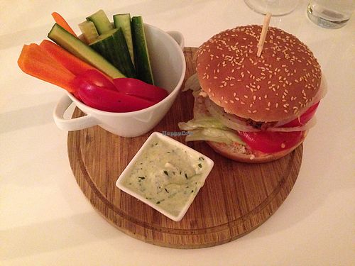 Vegan burger with crumbed aubergine patties and vegetable sticks with dip at The Green Garden in Salzburg