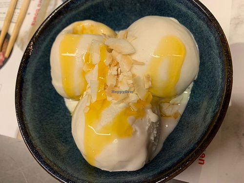 Vegan Coconut ice cream with passion fruit sauce  at Wagamama - Union Square in Aberdeen