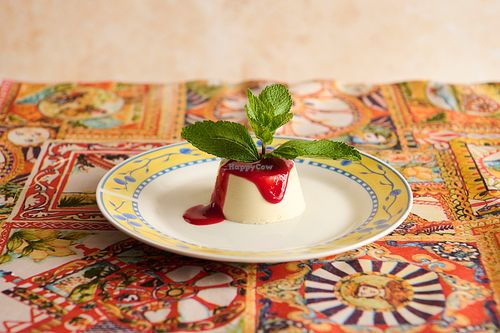 Homemade vegan panna cotta. Made with soy cream and oat milk, topped with raspberry coulis. at La Posata in Frederiksberg