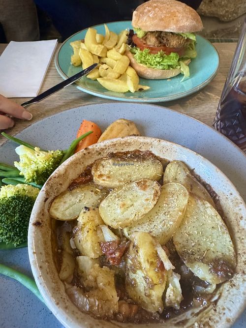 Aubergine and black bean burger with house chips and Parmentier pie with steamed green veg and roasted carrot and parsnip  at The Lazy Trout  in Leek