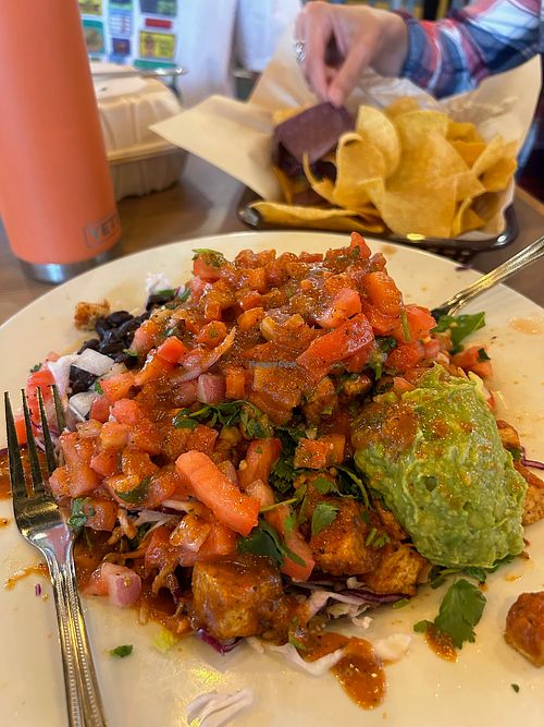 Salad loaded up with tofu and Sweet Chipotle sauce. All orders come with complimentary chips at Mucho Gusto  in Eugene