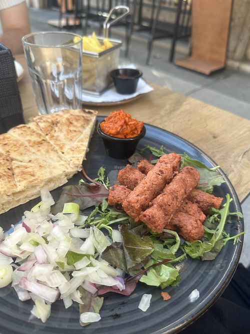 Vegan čevapi with ajvar, onions and lepinja  at CeWapi in Ljubljana