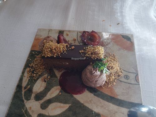 Chocolate slice with baked plums and pistachio crumbs at Oštarija Herbelier in Dolenjske Toplice