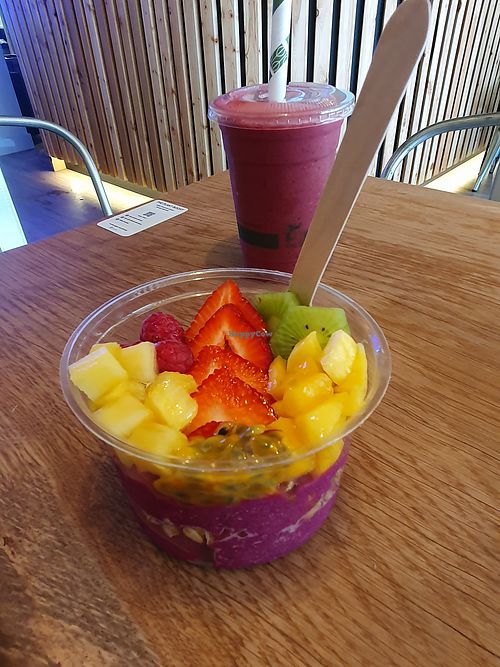 Pink Pitaya Bowl: Granola, strawberry, mango, pineapple, kiwi, raspberry, passionfruit, agave at The Plant Boost in Wilmslow