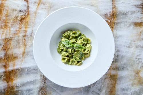 Gluten-free artisanal orecchiette pasta with Genovese pesto, made with fresh basil grown using vertical farming techniques, pine nuts, and extra virgin olive oil infused with basil. at Linfa da Visionnaire - Piazza Cavour in Milan