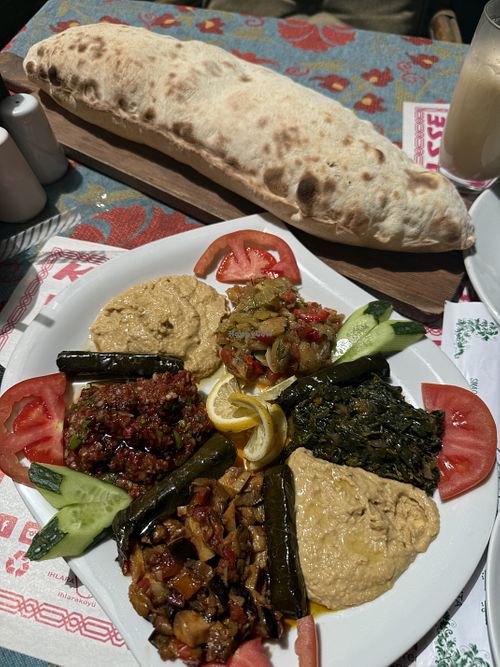 Large mezze platter with vegan bread   at Kale Terrasse Restaurant in Nevsehir