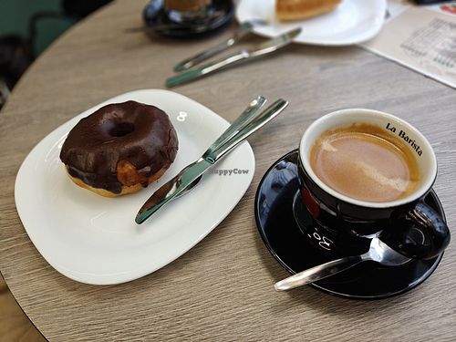 Café doppio y donut at Candy's Cafe in Granada