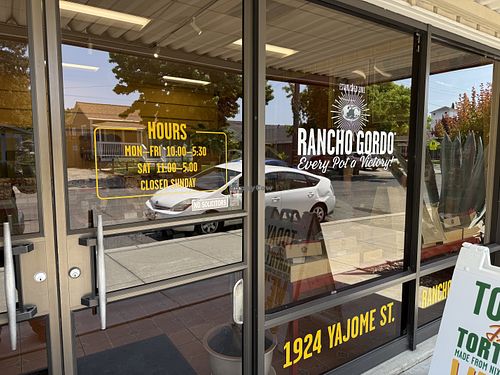 Door with hours   at Rancho Gordo in Napa