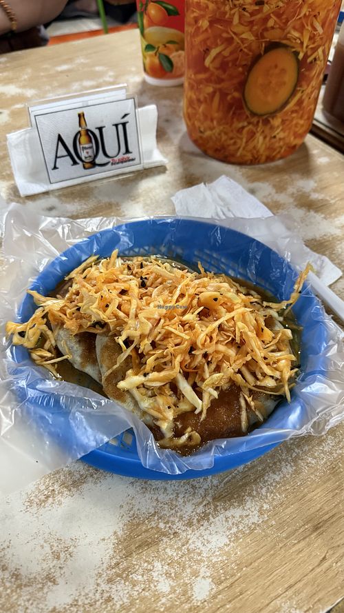 One pupusa with beans and one with squash, plus salsa and coleslaw  at Pupusería Zoila Olocuilta in Olocuilta