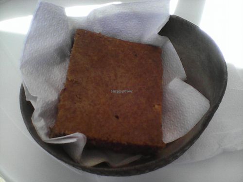 Banana & coconut cake served in a calabash bowl at Stone Love Ital Shop in Roseau