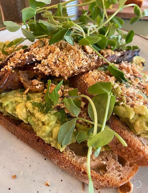 🌱MISO AUBERGINE 🌱Smashed avo & miso roasted aubergine on grilled sourdough, topped with a hazelnut cashew, sesame & almond dukka  at Trade in East London
