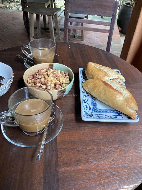 Breakfast (coffee, banh mi, and spicy corn)  at Yên Homestay & Vegan Macrobiotic in Hoi An