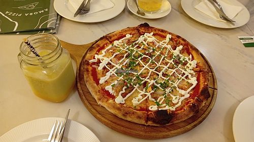 Vegan BBQ Jackfruit Pizza + Orange/avocado juice. Best vegan pizza experience. 🥰 at Amora Pizza in Doha