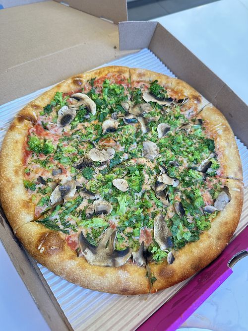 Vegan 12” pie with vegan cheese, broccoli rabe and mushrooms   at Elements Pizzeria  in Jackson Heights