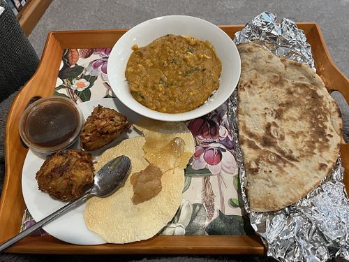Onion Bhajis, poppadoms, tarka daal, and tandoori roti   at Mughal Kitchen in Lincoln