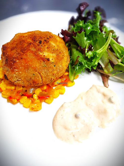 Vegan Crab Cake (hand-made with locally grown lion's mane mushrooms), served over maque choux with vegan aioli at Mondano in Old Forge