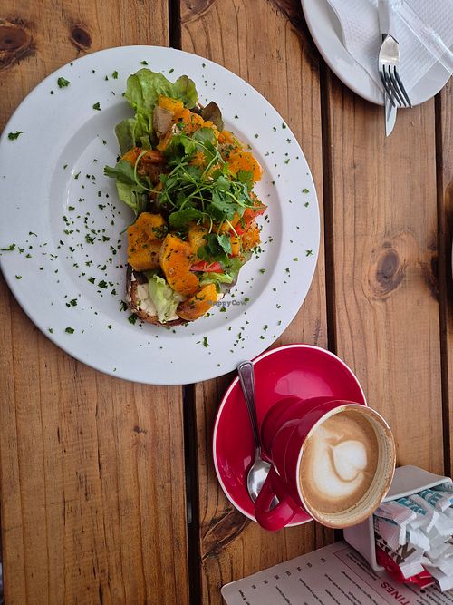 Bread with roasted veggies and flat white with oatmilk at Chrismann at The Trading Post in Swakopmund