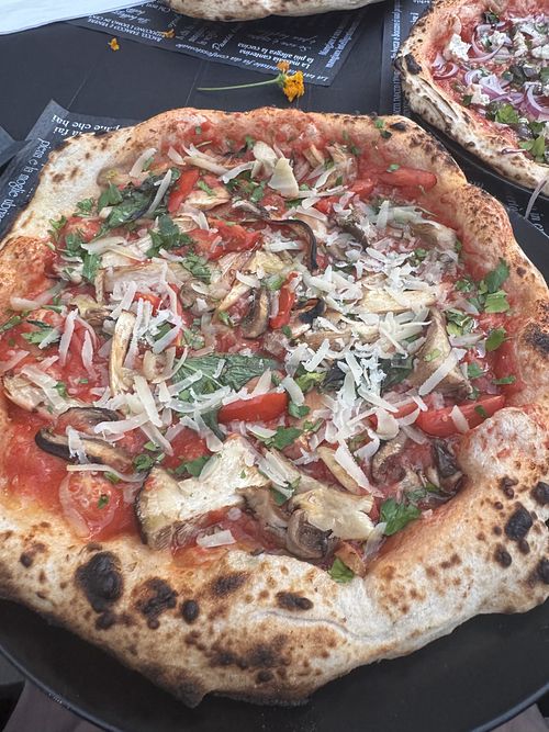 Pizza with vegan parmesann  at Genesi in Oristano