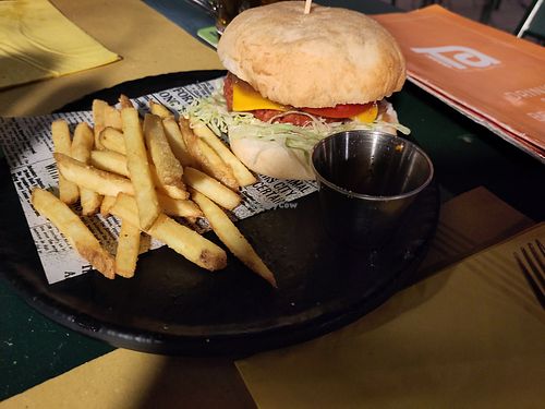 Vegan cheeseburger with beyond patty, vegan cheddar and vegan mayonese at Tana del Luppolo in Parma