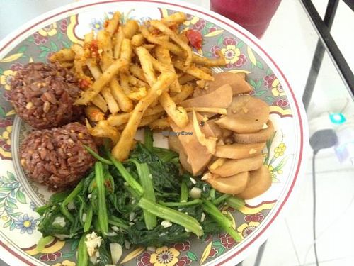 prem takeout; brown rice avocado balls, spinach, mushrooms with ginger and seitan at Prem Bistro and Cafe in Ho Chi Minh City