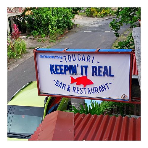 Venue sign at Keepin' It Real in Toucari