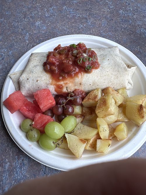 Cuban Burrito with tofutti cream cheese sub for cheddar. Extra veg sub for eggs. Side of roasted potatoes   at Wild Hare in Bemidji