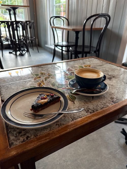 Vecan cake and coffee with oat milkk  at Paname Café in Torshavn