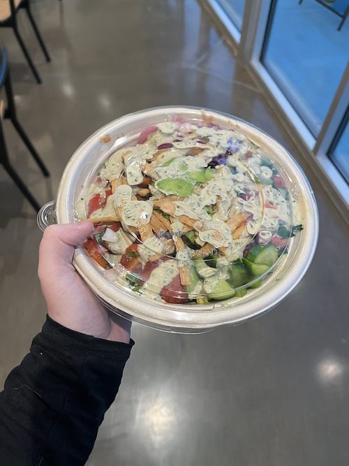 Fully vegan grains and veggie bowl drizzled with lemon tahini sauce to-go.  at CAVA in Burleson