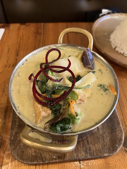 Green curry with tofu served with a rice pyramid  at IMM Thai Kitchen  in Toronto