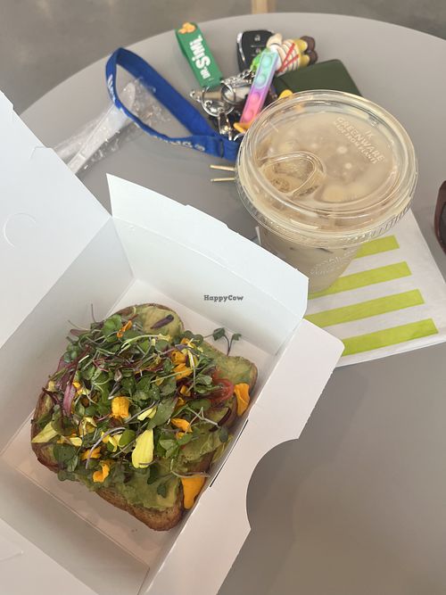 Vegan avo toast and iced oat latte  at Capital One Café in Santa Monica