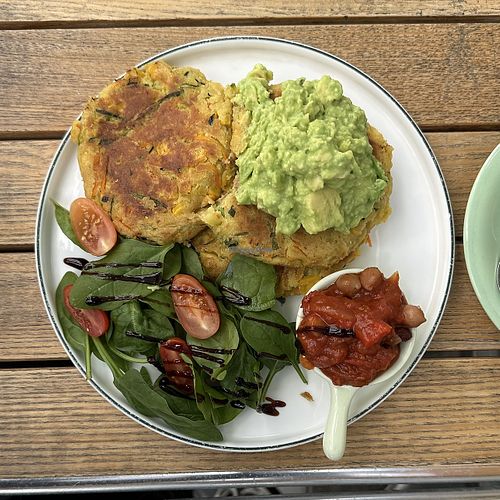 Corn fritters with smashed avocado and shakshuka beans  at 99 Shades Of Green  in Perth