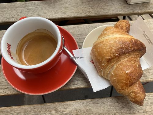 Cafe dopio and vegan croissant with apricot jam  at Tavola Fredda in Milan