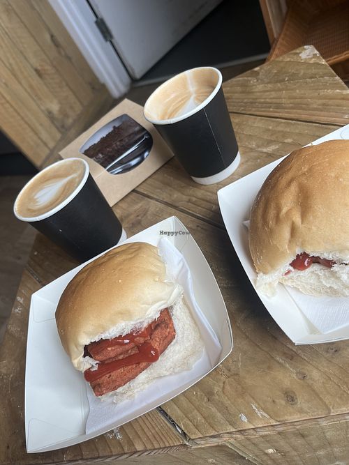 Square sausage breakfast rolls, oat flat white and chocolate fudge cake   at Drymen Bakery & Deli  in Drymen