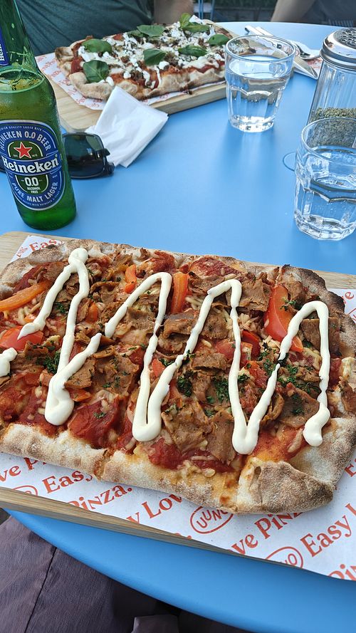 "Tulisonni" spicy tomato sauce, vegan cheese, seitan, parsley, aioli, bell pepper. at Uuno Herttoniemi in Helsinki