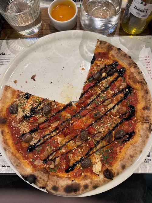 Pizza with some beans and vegan Parmesan, I would recommend this one   at Ideolo Pizza in Szczecin