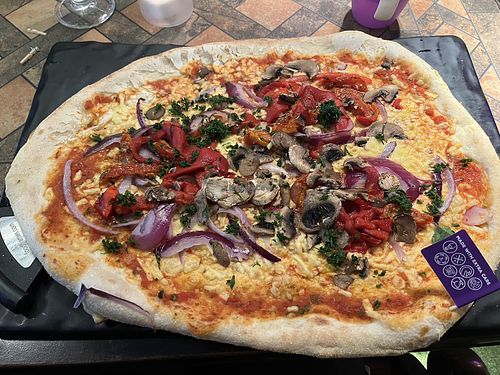 Geneva pizza with meat removed and vegan cheese added   at The Bulls Head East Leake in England